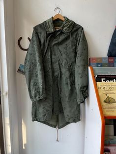 US Desert Night camo parka with liner attached! Marked size Small. Parka dated 1983. Liner dated 1981. Flat Measurements: Armpit to Armpit: 22.5" Shoulder to Shoulder: 18.5" Sleeve Length: 26" Total Length: 42.5" Head to our Sizing Guide to see if this will fit you. *Please note, all of our items are vintage and used and will naturally have some wear. We'll always do our best to properly document any obvious imperfections. **Colors may vary slightly between photos on screen and actual piece. Military Style Windbreaker For Hunting In Fall, Military Style Hunting Windbreaker For Fall, Khaki Military Parka For Hunting, Military Style Hooded Hunting Parka, Hooded Military Parka For Hunting, Vintage Camouflage Utility Jacket For Outdoor, Vintage Camouflage Outerwear For Hunting, Vintage Camouflage Outerwear For Outdoor, Vintage Camouflage Winter Outerwear