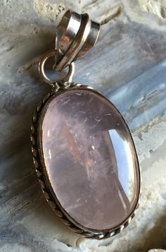 "Silver Plated Pink Quartz Crystal Pendant ONLY. This is a very old Silver Plated Pink Quartz Pendant. Please look closely at the pictures that show the wear of the pendant which makes it look even more vintage. The Pink Quartz cabochon is in good condition. So price is very low. Approx. size of Pendant is 1.875\" by 1.56\" REF: \"Pink\" Pendant ONLY" Vintage Large Oval Stone Pendant Jewelry, Vintage Oval Pendant Jewelry With Large Stone, Vintage Jewelry With Large Oval Stone Pendant, Vintage Pink Oval Pendant Jewelry, Vintage Oval Jewelry With Large Stone, Oval Large Stone Vintage Necklace, Vintage Oval Large Stone Necklaces, Vintage Pendant Jewelry With Large Stone, Vintage Oval Necklace With Large Stone