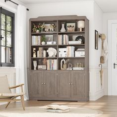 a living room filled with furniture and bookshelves next to a door leading to a patio