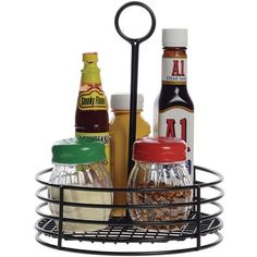 an assortment of condiments in a wire basket