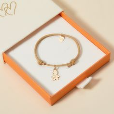 Celebrate your little one with our Children’s Personalized Mini Boy Bracelet. A special keepsake for them to treasure, each bracelet can be personalized to capture your little one’s unique character. Choose between a choice of vibrant braid colours to pair alongside a mini boy charm, hand engraved with their name.18K Champagne Gold Plated, 925 Sterling Silver or 18K Rose Gold PlatedMini Boy:0.47 x 0.31Braid made of a durable, colourfast polyesterFully adjustable sliding knot fasteningHand-engrav Cute Charm Bracelet With Removable Charms As Gift, Personalized Bracelet Charms For Gifts, Adjustable Charm Bracelets For Birthday, Customizable Adjustable Charms For Gifts, Customizable Adjustable Charms, Adjustable Customizable Charms For Gifts, Nickel-free Adjustable Charms For Birthday, Nickel-free Adjustable Birthday Charms, Adjustable Name Bracelet With Charms For Birthday