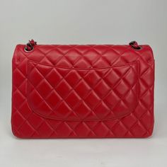 Chanel Classic Jumbo Double Flap Bag From 2014 with Gunmetal Hardware,Chain/Leather Straps,Interlocking CC Turn Lock Closure and Multiple Interior Compartments. Auth # 19986686 with Dustbag Designer = Chanel Color = Red Material = Lambskin Leather Condition = Very Good Height = 7.5 Width = 12 Depth = 3 1/2" Class = Premier Location: Chicago Item Number: 18321-1 Item ID: 255679 Category: Shoulder Bag Chanel Classic Jumbo, Gunmetal Hardware, Leather Chain, Flap Bag, Lambskin Leather, Item Number, Chanel Classic, Leather Straps, Dust Bag