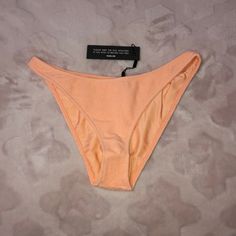 - Brand New With Tags, With Hygienic Liner, Never Worn - Authentic From Triangl - Size Xl Cheeky Bottoms But Runs Small - Peche Terry Material Pink Seamless Bottoms For Sunbathing, Peach Stretch Swimwear For Spring, Seamless Summer Party Bottoms, Summer Beach Peach Bottoms, Stretch Orange Bottoms For Beach Party, Seamless Swimwear For Spring Party, Peach Beachwear Swimwear For Spring, Seamless Party Swimwear For Spring, Peach Fitted Swimwear For Poolside