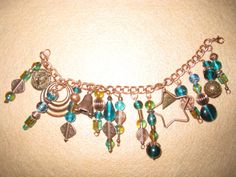 Teal glass beads and copper colored beads along with copper colored trinkets brings this 7" bracelet alive! Handcrafted. Handmade Copper Beaded Bracelets With Round Beads, Handmade Copper Beaded Bracelets, Beaded Bronze Copper Bracelets, Bronze Beaded Copper Bracelets, Beaded Stuff, Teal Glass, Glass Bead Bracelet, Lancaster Pa, Glass Beaded Bracelets