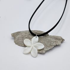 Handmade necklace with a layer of faux suede and a white shell flower pendant. The high-grade stainless steel beads, chain and findings are hypoallergenic, durable, and won't tarnish. Flower size: around 34mm x 35mm The high-grade stainless steel chain, beads and findings are hypoallergenic, durable, and won't tarnish. 2 options of length: * 38cm + 7cm of an extender chain. Total length is 45cm. * 48cm + 7cm of an extender chain. Total length is 55cm. If you want a different length please leave Hawaiian Flower Necklace, Surf Necklace, Hawaiian Flower, Beads Chain, Hawaiian Flowers, Handmade Necklace, Flower Pendant, Flower Necklace, White Flower