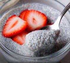 a bowl filled with chia pudding and strawberries