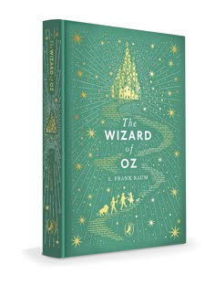 the wizard of oz book with green cover and gold foil lettering on it, against a white background