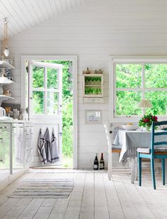 the kitchen is clean and ready to be used as a dining room or breakfast nook