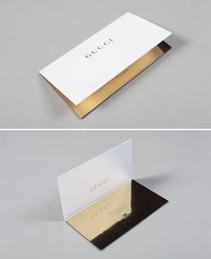 an open and closed business card with the word gucci on it in gold foil