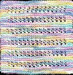 a multicolored crocheted blanket with black border on the bottom and sides