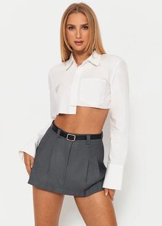 Achieve an effortlessly sophisticated look with this white crop shirt from our collection. Featuring a long sleeve lapel neck and front pocket, it's finished with an asymmetrical hem for an air of modernity. Crafted with luxurious fabrics, it will elevate any outfit, adding a touch of elegance. Material:90% Polyester, 10% Spandex Chic Cropped Shirt With Pockets For Work, Fitted Long Sleeve Cropped Shirt For Day Out, Chic Button-up Cropped Shirt With Pockets, Chic Cropped Button-up Shirt With Pockets, Spring Office Cropped Shirt With Long Sleeves, Spring Office Cropped Long Sleeve Shirt, Fitted Long Sleeve Cropped Shirt For Work, Trendy Long Sleeve Cropped Shirt For Day Out, Spring Long Sleeve Cropped Shirt For Office