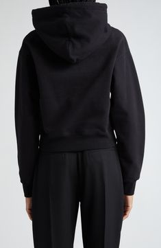 This cropped hoodie from the label's Les Classiques collection is made from cozy cotton fleece and detailed with a logo-embroidered grosgrain ribbon. 21" length (size Medium) Drawstring hood Dropped shoulders Ribbed cuffs and hem 100% cotton Machine wash, dry flat Made in Portugal Designer Clothing Hooded Cotton Sweats, Black Athleisure Hoodie With Embroidered Logo, Designer Clothing Brands, Cotton Hoodie, Cotton Fleece, Crop Sweatshirt, Cropped Hoodie, Logo Embroidered, Grosgrain Ribbon