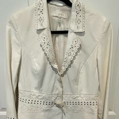 Beautiful Head Turning White Lamb Leather Jacket With Laser Cut Lace And Studs Self Belted As Shown Designer Cream Blazer For Spring, Designer White Blazer For Spring, White Designer Blazer For Spring, Designer White Spring Blazer, White Embroidered Spring Outerwear, White Embroidered Winter Outerwear, Luxury Fitted White Leather Jacket, White Lace Outerwear With Lace Trim, Designer White Embroidered Outerwear