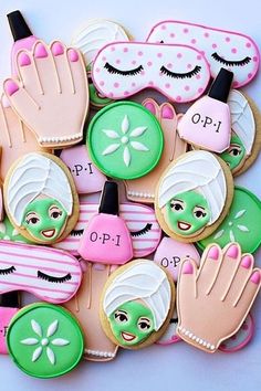 decorated cookies are arranged in the shape of hand, eye and face masks on top of each other