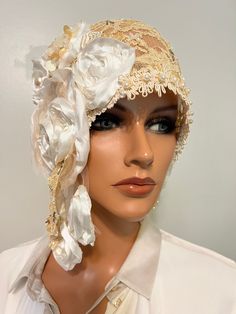 This is beautiful Ladies  flapper hat , headdress, wrap is in antique flapper style daytime hat  has my handmade design is in version of my collection fabulous 20's  and Modern style hats ,heirloom"LudasHatBoutique". Ladies wrap for any occasions. You can wear it many different ways with any dress and will look great costume outfits Era. Asymmetrical hat is made  one of kind cream coffe/ yellowish lace , NOT stretchy lace,handmade floral,  embroidery pearls/glass, antique  trim, pleated floral is in Millinery artwork antique style, nostalgia Wedding 20s , fully stitching by  hands . You can wear it many different ways with any dress and will look gorgeous. This charming piece will fit heads to measure one size fits 23.8"  . Mannequin head is 22". Only hat. Check my other items and maybe yo Flapper Style Fascinator For Vintage Events, Gold Gatsby Headpiece For Vintage Events, Adjustable Gatsby Style Hats For Kentucky Derby, Bohemian Adjustable Fascinator For Weddings, Fitted Gatsby Style Hat Headpiece, Adjustable Gatsby Mini Hats For Vintage Events, Gatsby Style Adjustable Costume Hats For Kentucky Derby, Elegant Fitted Bonnet Cap, Fitted Gatsby Hat Headpiece