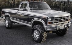 a black and silver truck parked in a parking lot