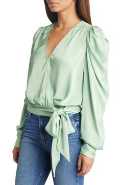 A serene shade and a lustrous fabric softly animate this graceful blouse styled with the season's abundant sleeves. 20" length (size medium) 100% polyester Dry clean Imported Green Silk V-neck Top, Chic Fitted Blouse With Draped Sleeves, Spring Evening Blouse With Lantern Sleeves, Elegant Green Top With Gathered Sleeves, Chic Green Top With Gathered Sleeves, Green Fitted Top With Gathered Sleeves, Chic Green Tops With Gathered Sleeves, Fitted Silk Blouse With Draped Sleeves, Spring Evening Tops With Lantern Sleeves