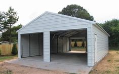 a white garage with an attached carport