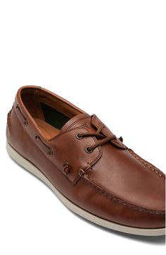 Elastic reinforcements on the tongue lend a versatile twist to this dapper leather boat shoe that can be worn with or without the laces. Leather upper/leather and textile lining/rubber sole Imported Brown Boat Shoes With Textured Sole And Plain Toe, Brown Low-top Boat Shoes, Brown Leather Boat Shoes For Boating, Brown Leather Footbed Boat Shoes, Boat Shoes With Textured Sole And Slip-on Design, Casual Leather Boat Shoes With Removable Insole, Slip-on Boat Shoes With Textured Sole, Brown Plain Toe Boat Shoes With Leather Lining, Plain Toe Boat Shoes With Leather Lining For Business