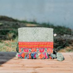 This beautiful crossbody bag is made with an amazing piece of fabric woven by the HMONG hill tribes of Lanna Country (Northern Thailand). It has multi pom pom tassels and It's a great bag for carrying anything. It features a zippered opening area and inside zippered pocket. We buy materials from Hmong market and we design and sew by hand. Some of the bags we modify to improve the product. The Hmong tribes live in the North of Thailand and have origins from the Tibetan area of China. ------------ Sew By Hand, Northern Thailand, Tassel Bag, Embroidered Bag, Fall 2022, Bag For Women, Woven Fabric, Batik, Hand Sewing