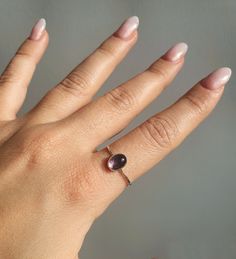 "This Oval Amethyst Gemstone Dainty Ring is a beautiful and delicate piece of jewelry that will add sparkle to any outfit. Crafted with 925 sterling silver, it features a dainty oval minimalist ring set in amethyst crystal, making it an eye-catching accessory for everyday wear or special occasions. The perfect birthstone crystal ring for yourself or as a meaningful gift for someone special. * 925 Sterling Silver ring with a Amethyst Crystal  * Delicate, dainty design perfect for everyday wear or special occasions. * Perfect gift for her - sister, mother, daughter, friend, or yourself. * Comes in an elegant jewelry box, ready for gifting. * Nickel-free and hypoallergenic. * High-quality gemstones sourced from India. * Handmade using traditional artisan techniques. * Lightweight and comforta Amethyst Oval Ring, Dainty Amethyst Ring For Anniversary, Dainty Amethyst Ring For Gift, Minimalist Amethyst Promise Ring, Dainty Amethyst Ring As Birthstone, Minimalist Amethyst Birthstone Promise Ring, Dainty Amethyst Birthstone Ring, Dainty Amethyst Stackable Rings For Promise, Dainty Amethyst Gemstone Stackable Rings