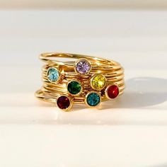 Give mom the gift of birthstone jewelry as a token of her love. Our birthstone rings were delicately designed to stack perfectly. Stack up to 5 rings together.  *SHIPS FAST in 1-3 business days* Band width: 1.2 mm  Stone size: 3 mm  Available in whole US sizes. 4 - 11  These rings are fitting true to size These are carefully made with 18k gold PVD coated stainless steel. This process vacuum seals the coating of 18K gold directly onto the steel producing a durable and tarnish-proof finish for years of wear. Additionally, stainless steel is hypoallergenic and won't turn your skin green. Gold Plated Dainty Stackable Rings As Gift, Dainty Gold Plated Stackable Rings Gift, Hypoallergenic Stackable Rings In 14k Gold Filled As Gift, Hypoallergenic 14k Gold Filled Stackable Rings As Gift, Hypoallergenic Stackable 14k Gold Filled Rings As Gift, Gold Plated Birthstone Ring For Promise, Gold Rings With Birthstone In 14k Gold Filled, Dainty Gold Birthstone Ring As Gift, Adjustable Gold Stackable Rings With Birthstone