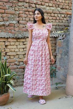 ITEM DESCRIPTION indian red-pink floral pattern printed women's maxi dress - V neckline with tassels cotton long dress Features : short sleeve, square neck, Long dress Fabric: 100% Cotton cambric hand block printed fabrics  Sleeve Length = 6 inch For more sizes & their measurement, please refer our below chart to understand the sizes variations available with us For your size requirement, please mention your size in seller note at the time of buying. SIZE MEASUREMENT  BUSTLENGTHSHOULDER XXS34 in Square Neck Long Dress, Cotton Long Dress, Pink Floral Pattern, Floral Prints Pattern, Block Printing Fabric, Womens Maxi Dresses, Dress Clothes For Women, Dress Fabric, V Neckline