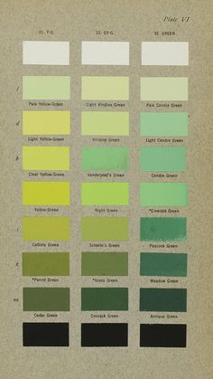 an old book with different colors of paint on the pages, including green and yellow