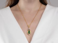 One-of-a-Kind Necklace in 24k/22k/18k Yellow Gold, 15x11mm Teardrop Set in Wide Frame from the Muse Collection, with Emerald Luxury Teardrop Emerald Necklace In Yellow Gold, Gold Pear-shaped Emerald Gemstone Necklace, Pear-shaped Gold Emerald Necklace, Elegant Gold Teardrop Pendant Emerald Necklace, Gold Pear-shaped Emerald Necklace For Anniversary, Gold Emerald Teardrop Pendant Necklace, Gold Teardrop Pendant Emerald Necklace, Gold Pear-shaped Drop Necklace With Gemstone, Gold Pear-shaped Emerald Necklace Gift