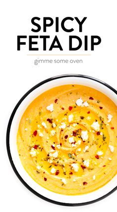 a bowl of soup with feta cheese on top and the words spicy feta dip above it