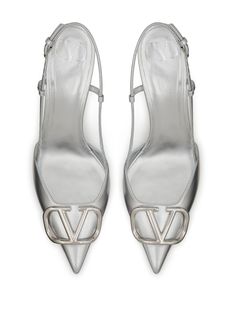 Valentino Garavani VLogo Signature 80mm Slingback Pumps - Farfetch Chic Metallic Silver Heels With Heel Strap, Silver Ankle Strap Slingback Pumps With Buckle, Elegant Metallic Silver Heels With Heel Strap, Formal Silver Heels With Buckle Closure, Luxury Silver Slingback Pumps With Sculpted Heel, Luxury Silver Heels With Buckle Closure, Silver Slingback Pumps With Branded Heel For Evening, Silver High Heel Luxury Slingback Pumps, Pointed Toe Heels With Silver-tone Hardware For Evening