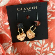 Pretty In Pink! Actually A Pinkish/ Coral Color Heart Sigh Coach Written In Them Dangling From A Small Pierced Gold Tone Hoop. Questions? Leave A Comment Below! Two Different Backings Pink Hoop Earrings For Valentine's Day, Cute Pink Hoop Earrings For Valentine's Day, Pink Heart Charm Hoop Earrings For Valentine's Day, Pink Hoop Earrings With Heart Charm For Valentine's Day, Personalized Hoop Earrings For Valentine's Day, Valentine's Day Personalized Hoop Earrings, Coach Heart Charm Heart Jewelry, Coach Heart Charm Jewelry, Coach Gold Heart-shaped Jewelry