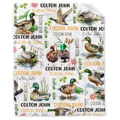 a blanket with ducks on it and the name cotton john written in different languages,