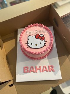 a hello kitty birthday cake in a box