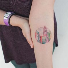 a person with a small tattoo on their arm