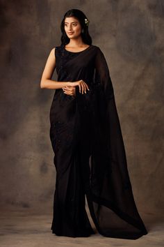 Black saree highlighted with applique hand embroidery. Comes with round neckline blouse and petticoat.
Component: 3
Embroidered
Neckline: Round
Sleeve Length: Sleeveless
Fabric: Silk Organza
Color: Black
Hand embroidered blouse - Aza Fashions Round Neckline Blouse, Dori Work, Draped Saree, Butterfly Net, Saree Poses, Indian Fashion Saree, Drape Saree, Saree Photoshoot, Black Saree