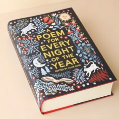 a poem for every night of the year is written in an intricately decorated book