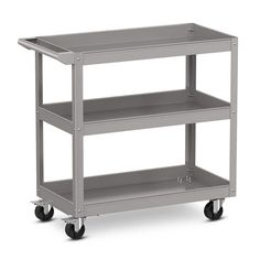 a metal shelf with three shelves on wheels