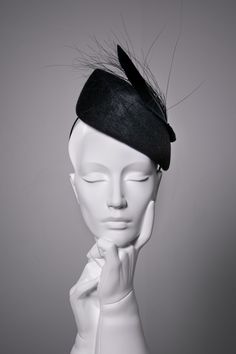 Sara is a felt percher hat, made from beautiful high-quality velour felt.   This elegant cocktail hat is finished with a modern feather detail. The hat modelled is shown in 'Midnight'.  The hat can also be made in lots of additional colours*. This hat is high at the crown and would suit the following face shapes: oval, round, square, and heart.  Please ask if you would like advice on styling before purchasing. Hat Details: * The hat secures with a metal comb and millinery headband, this can be d Modern Halo Hats, Luxury Elegant Flat Bill Hat, Millinery Headband, Royal Garden Party, Hat With Feather, Colour Wedding, Church Clothes, Occasion Hats, Derby Fascinator