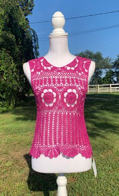 "Lacy Crochet Tank Top.  Great with a camisole underneath or as a bathing suit coverup.  Looks great with jean, shorts, or a skirt.   1. Pink top - made with cotton yarn  - 32\" wide and 20 in\" long from shoulder to bottom. 2. Blue top - made with cotton yarn - 40\" wide and 24 in\" long from shoulder to bottom. 3. Custom order - message me with color Custom Orders usually take about 2-3 weeks to create (not including shipping time). However, depending on the number of orders I have, it could take more or less time to make the item and ship it to you. If you need it by a certain day, feel free to message me and I can let you know if that will be possible!Dress form used is a size medium." Sleeveless Tops For Beach Party In Spring, Sleeveless Tops For Spring Beach Party, Sleeveless Stretch Crochet Top For Beach Season, Stretch Sleeveless Crochet Top For Beach Season, Fitted Tank Top For Spring Beach Party, Fitted Lace Crop Top For Summer, Stretch Crochet Top For Summer, Hippie Stretch Tops For Beach, Hippie Stretch Tops For The Beach