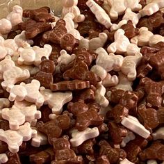 a pile of brown and white candy bears