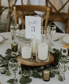 the table is set with candles and place cards