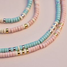 Bring alllllll the beach vibes anywhere you go with our Sealife Necklace. This beaded beauty comes in two sweet shades—a sand-inspired pink and sea-inspired turquoise—plus pops of silver or gold for a mini dose of shine. - Turquoise: brass base with rhodium plating & synthetic howlite beads- Sand: brass base with gold plating & synthetic howlite beads- Chain: 14" with 2" extension. Jump ring at 1" of extension.- Because jewelry products are handcrafted by artisans, dimensions may vary from piece Surf Necklace Pura Vida, Cheap Beaded Necklaces For Beach Season, Cheap Vacation Necklaces With Heishi Beads, Cheap Adjustable Necklaces For Vacation, Cheap Strand Necklaces For The Beach, Cheap Turquoise Necklace With Colorful Beads For Beach, Cheap Turquoise Beach Jewelry, Cute Cheap Beach Necklaces, Cheap Trendy Beaded Necklaces For Beach