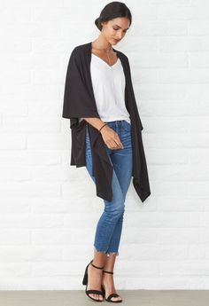 This versatile piece goes from cardigan to wrap to scarf! Ideal for travel and layering in soft, sustainable modal. Shop Now! Shawl For Layering, Black Oversized Versatile Cardigan, Oversized Black Versatile Cardigan, Oversized Black Long Kimono, Black Oversized Open Front Cardigan, Oversized Black Open Front Cardigan, Black One Size Shawl Wrap, Versatile Wraps For Layering, Black Wrap Cardigan For Fall