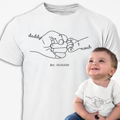 Personalised Daddy Tshirt - The perfect gift for Daddy or Grandad, for father's day, birthday or to celebrate a new birth, a brilliant first father's day gift! This quality t-shirt makes a unique gift for any proud dad or grandad! Available to buy as a single tshirt, or as a matching pair, one for dad and one for baby! The t-shirts are made of quality soft polyester/cotton mix fabric, making them almost creaseless, no need to iron! Sizes medium to extra large in the men's tshirt. 0-3 month body vests, 6-12 months, 12-18 months, 18-24 months in white tshirts for the baby. Choose daddy, grandad or type in the name you would like and the baby name. Add and Established date (date of birth) if you wish or wording of your choice eg: we've got this Type all the information in the personalisation Personalized White T-shirt For Father's Day, Father's Day White T-shirt With Custom Print, Customizable White T-shirt For Birthday Gift, Family Matching T-shirt With Name Print For Birthday Gift, Personalized T-shirt For Father's Day, Customizable T-shirt For Father's Day, White T-shirt For Father's Day Family Events, White T-shirt For Father's Day Gift, Customizable White T-shirt For Personalized Gift