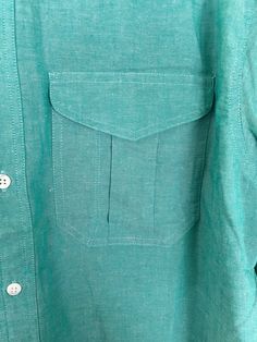 "-Description- >Claiborne men's teal button down shirt >new old stock - original tags still attached >button down >collared >two flap close pockets on the front >size medium/large - tag marked a medium but chest measurement is more like a large, please check all measurements before purchase >so preppy! >condition: new old stock - original tags still attached >color(s): teal >fabric(s): 100 cotton >brand: claiborne >care: machine wash -Measurements- >size: s Classic Green Shirt With Pockets, Classic Green Camp Shirt With Button Closure, Green Button-up Camp Shirt With Pockets, Green Button-up Shirt With Snap Buttons, Green Relaxed Fit Camp Shirt With Buttons, Green Collared Tops With Welt Pockets, Green Button-up Camp Shirt, Green Unstructured Cotton Shirt, Unstructured Green Cotton Shirt