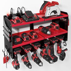 a red and black shelf filled with tools