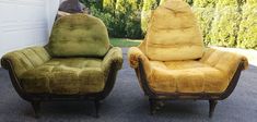 two chairs sitting next to each other in front of a garage