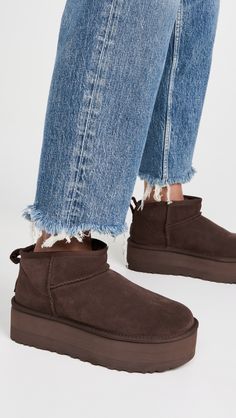 Find UGG Classic Ultra Mini Platform Boots on Editorialist. Cannot be shipped outside the USA Upper: Cowhide suede. Lining: Sherpa. No closure, pull-on design. Round toe. EVA sole. Imported, Vietnam. This item cannot be gift-boxed. Measurements: Platform: 2.25in / 60mm Ugg Classic Ultra Mini Platform, Cute Winter Shoes, Ugg Ultra Mini Platform, Uggs Outfit Winter, Brown Uggs, Ugg Snow Boots, Brown Ugg Boots, Ugg Boots Outfit, Ugg Ultra Mini