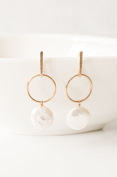 "Not your mama's pearls earrings! A fresh take on a classic design. These freshwater coin pearls are modern but with edgy femininity.  14kt gold fill. Earrings measure: 1 3/4\"L x 1/2\"W Mindfully designed and handmade in Houston, TX." Modern Round Pearl Drop Jewelry, Modern Pearl Earrings For Anniversary, Modern Pearl Drop Earrings For Anniversary, Modern Pearl White Earrings With Pearl Drop, Modern Pearl Charm Jewelry For Anniversary, Modern White Round Pearl Earrings, Modern Pearl Jewelry With Matching Earrings, Modern Round Pearl Earrings With Pearl Charm, Modern Pearl White Pearl Earrings For Gift